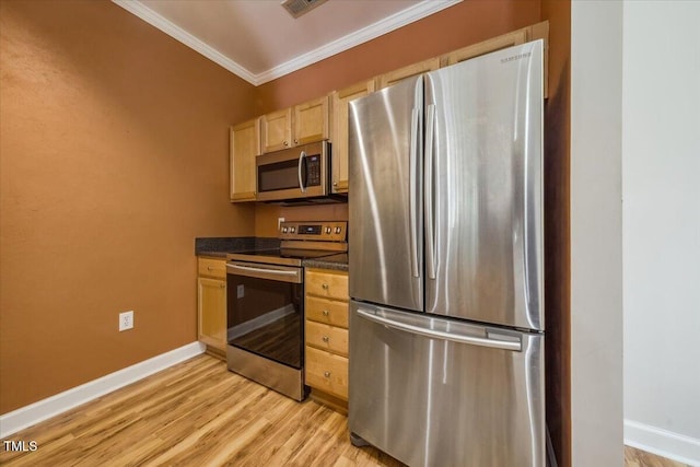 1301 Durlain Dr Unit 103, Raleigh, NC 27614 - kitchen with stainless steel appliances, ornamental molding, dark countertops, light wood-style flooring, and baseboards