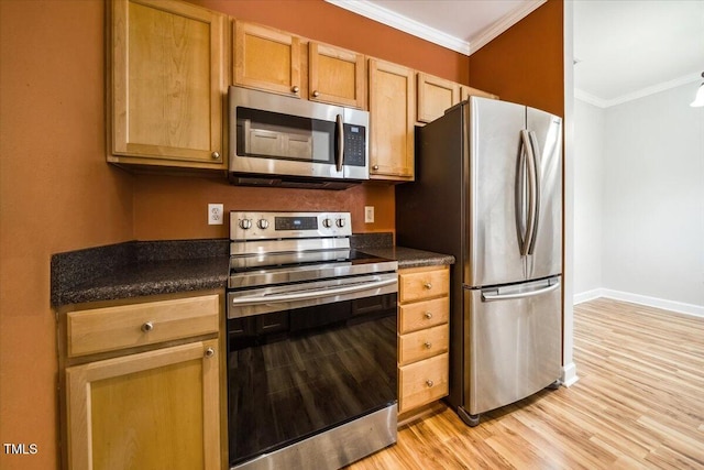 1301 Durlain Dr Unit 103, Raleigh, NC 27614 - kitchen with appliances with stainless steel finishes, ornamental molding, dark countertops, light wood-style floors, and baseboards