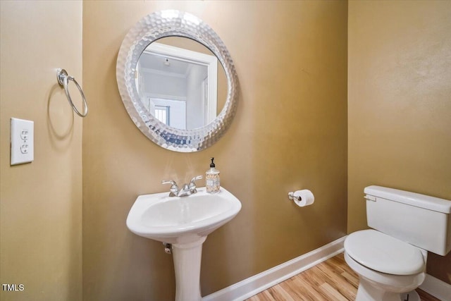 1301 Durlain Dr Unit 103, Raleigh, NC 27614 - half bath with toilet, baseboards, and wood finished floors