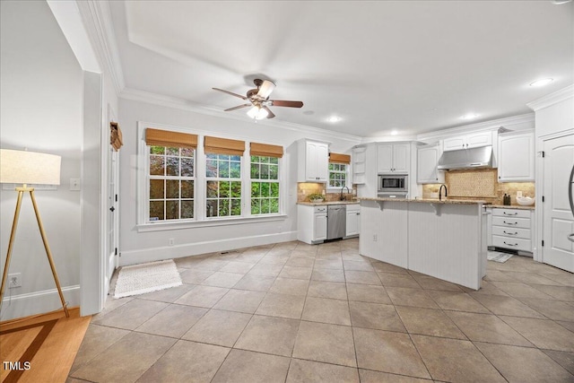 2507 Mayview Rd, Raleigh, NC 27607 - kitchen with under cabinet range hood, a ceiling fan, tasteful backsplash, ornamental molding, and light tile patterned flooring