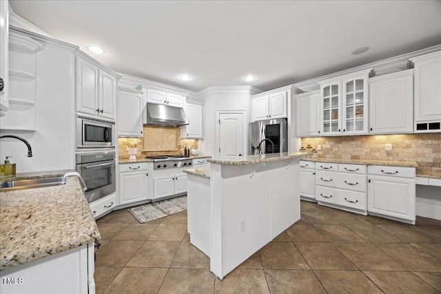2507 Mayview Rd, Raleigh, NC 27607 - kitchen with stainless steel appliances, a sink, under cabinet range hood, white cabinetry, and recessed lighting