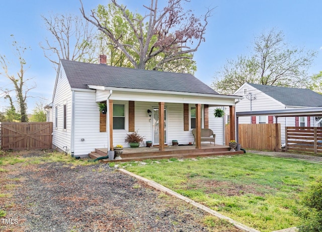 2508 Albany St, Durham, NC 27705 - view of front facade with covered porch, a chimney, a gate, and roof with shingles
