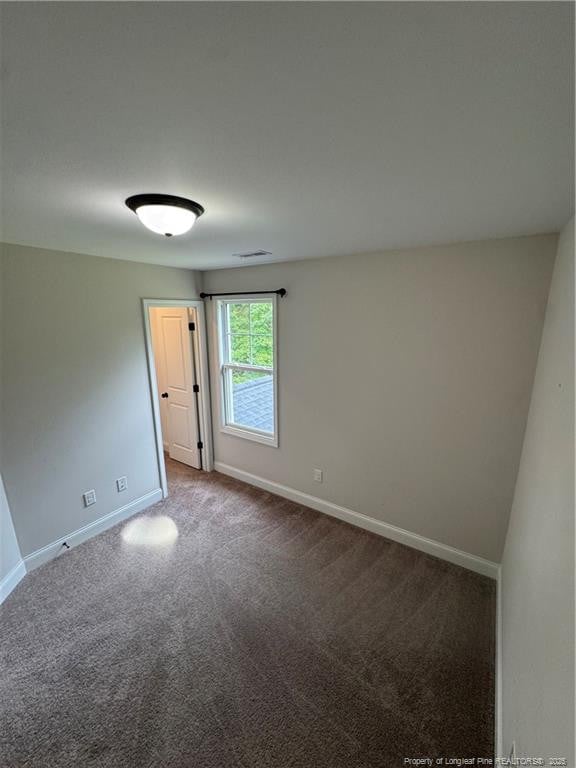 4161 Overhills Rd, Spring Lake, NC 28390 - carpeted spare room featuring baseboards