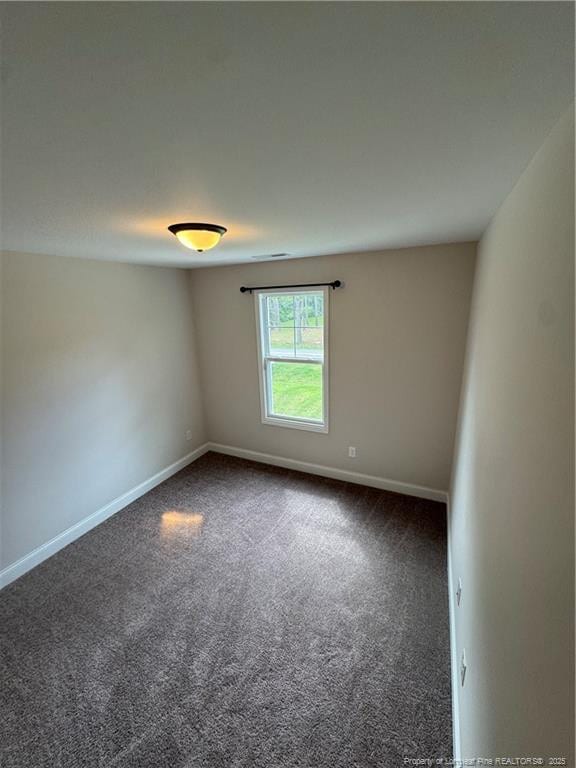4161 Overhills Rd, Spring Lake, NC 28390 - unfurnished room featuring dark carpet and baseboards