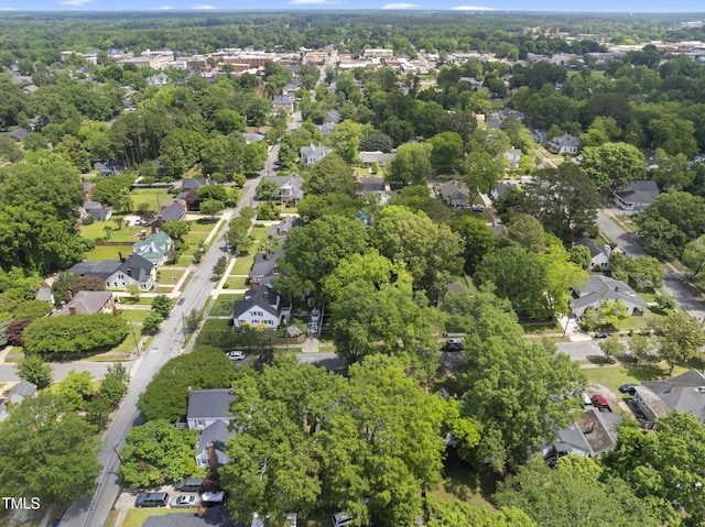 aerial view of property and surrounding area with nearby suburban area