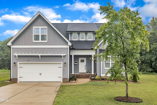 1109 Agio Ct, Zebulon, NC 27597 - craftsman inspired home with driveway, board and batten siding, a front lawn, a garage, and roof with shingles