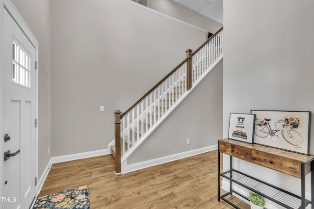 1109 Agio Ct, Zebulon, NC 27597 - entryway featuring wood finished floors, baseboards, and stairway
