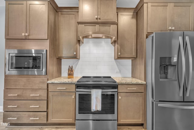 1109 Agio Ct, Zebulon, NC 27597 - kitchen with stainless steel appliances, decorative backsplash, and light stone countertops