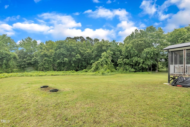 1109 Agio Ct, Zebulon, NC 27597 - view of grassy yard with a sunroom and view of golf course