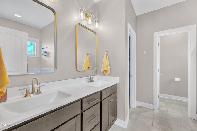 1109 Agio Ct, Zebulon, NC 27597 - full bath featuring double vanity, baseboards, and tile patterned floors