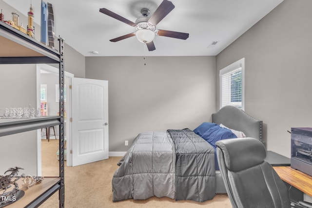 1109 Agio Ct, Zebulon, NC 27597 - bedroom with carpet, a barn door, and ceiling fan