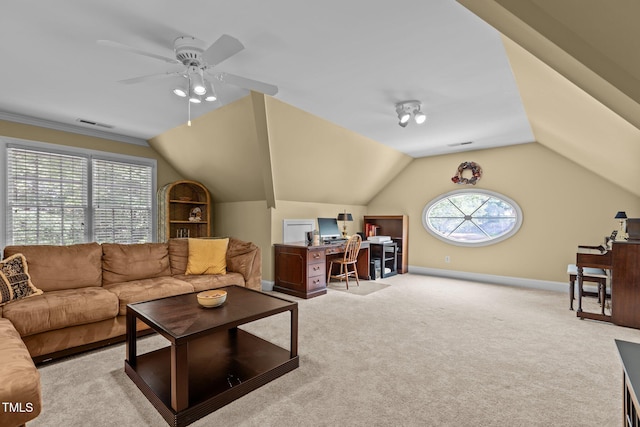 carpeted living room with a desk, ceiling fan, vaulted ceiling, and baseboards