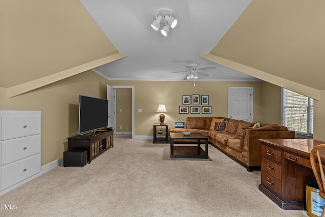 living area with light colored carpet, crown molding, ceiling fan, and baseboards