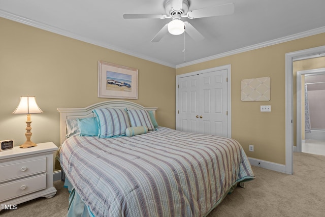 bedroom featuring light carpet, a closet, ornamental molding, baseboards, and a ceiling fan