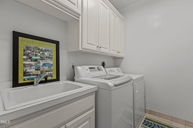 clothes washing area featuring independent washer and dryer, cabinet space, ornamental molding, and tile patterned flooring