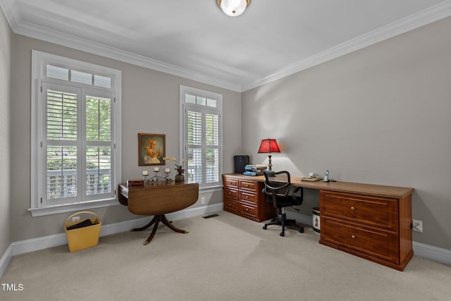 carpeted home office with ornamental molding and baseboards