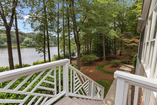 wooden deck featuring a water view