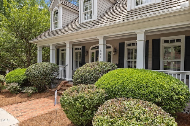 doorway to property featuring a porch
