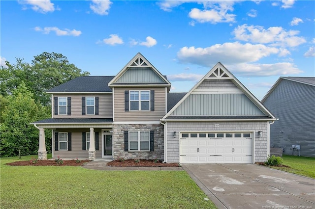 view of front facade featuring concrete driveway, a garage, a front yard, stone siding, and board and batten siding