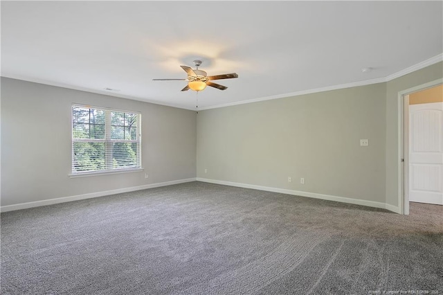spare room with a ceiling fan, baseboards, ornamental molding, and carpet floors
