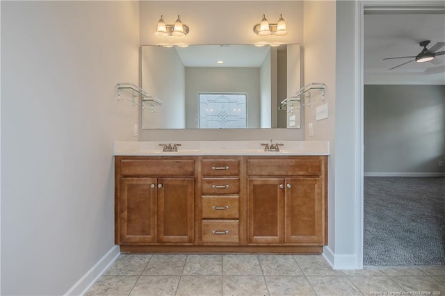full bathroom featuring baseboards, a ceiling fan, and double vanity