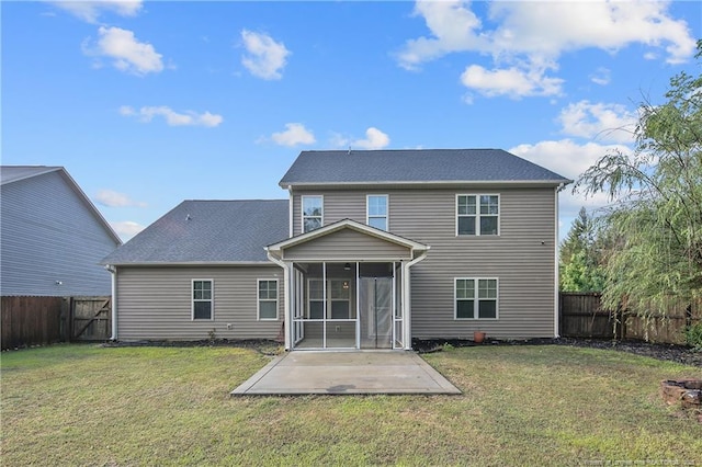 rear view of property featuring a sunroom, a patio, and a gate