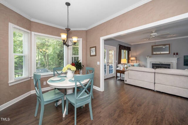 203 W Hill Dr, Cary, NC 27519 - dining space featuring dark wood-style flooring, plenty of natural light, a chandelier, and ornamental molding