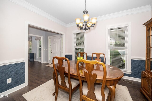 203 W Hill Dr, Cary, NC 27519 - dining space featuring a chandelier, ornamental molding, plenty of natural light, and dark wood-style flooring