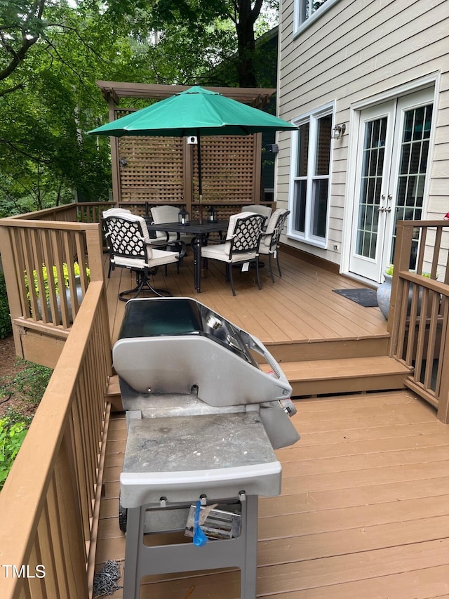 203 W Hill Dr, Cary, NC 27519 - wooden terrace with french doors and outdoor dining area