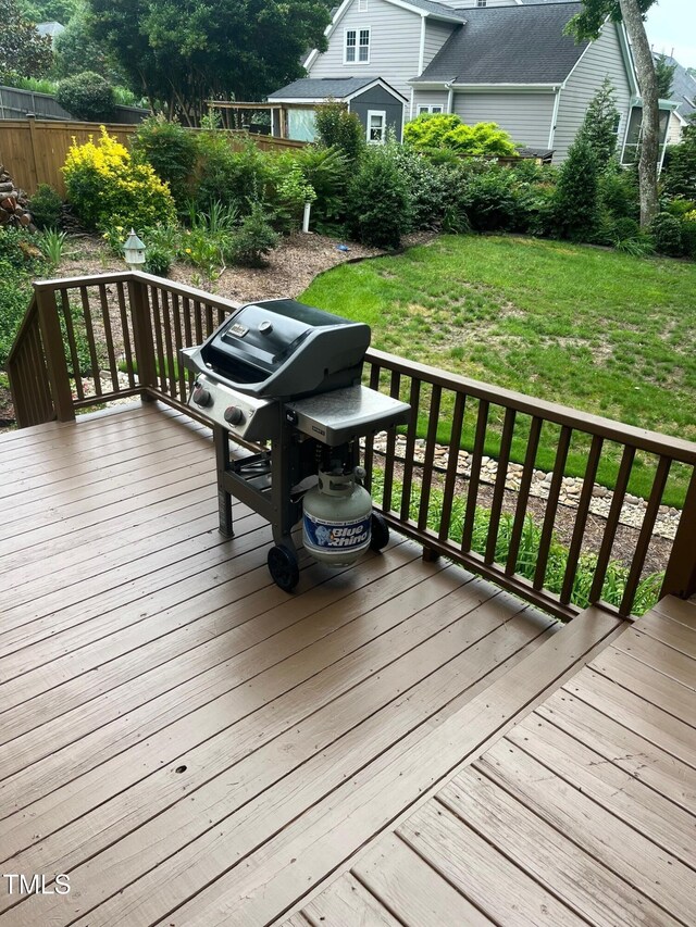 203 W Hill Dr, Cary, NC 27519 - wooden deck with a lawn and grilling area