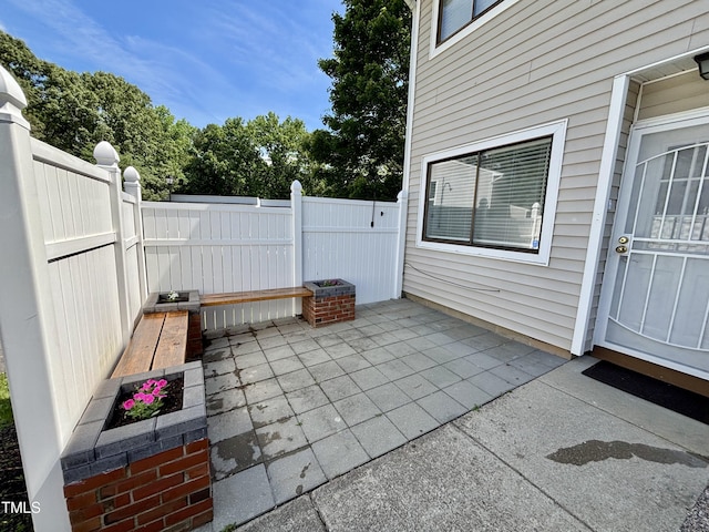 view of patio / terrace featuring fence