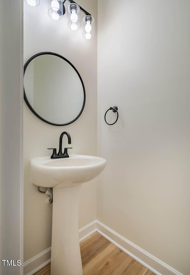 bathroom featuring baseboards and wood finished floors