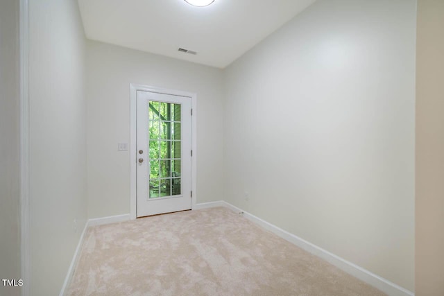 entryway with carpet flooring and baseboards