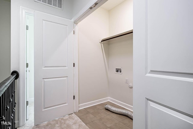 laundry room with washer hookup and baseboards
