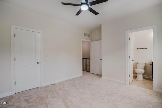 unfurnished bedroom featuring carpet, baseboards, and connected bathroom