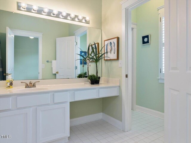 102 Westside Dr, Chapel Hill, NC 27516 - bathroom with vanity, tile patterned flooring, and baseboards