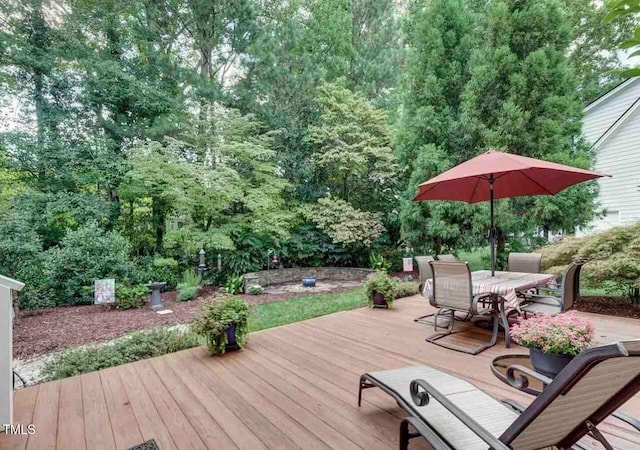 wooden terrace with outdoor dining space