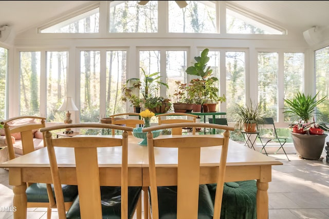 sunroom / solarium with vaulted ceiling and tile patterned floors
