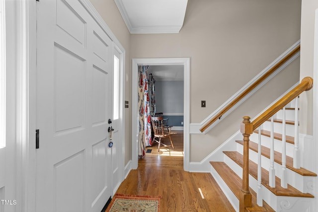 2645 Ridgewell Ct, Raleigh, NC 27613 - entrance foyer featuring ornamental molding, light wood-style floors, stairway, and baseboards