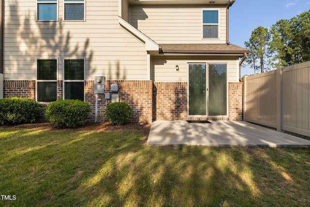 310 Alamosa Pl, Cary, NC 27519 - back of property with brick siding and a patio area