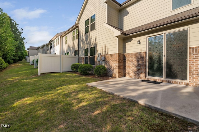 310 Alamosa Pl, Cary, NC 27519 - view of side of home with brick siding and a patio