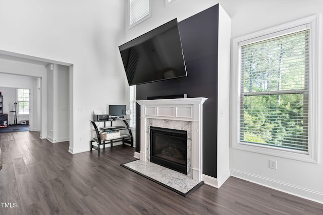 310 Alamosa Pl, Cary, NC 27519 - living area featuring a premium fireplace, dark wood finished floors, and baseboards