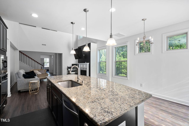 310 Alamosa Pl, Cary, NC 27519 - kitchen featuring a sink, appliances with stainless steel finishes, dark wood finished floors, plenty of natural light, and recessed lighting