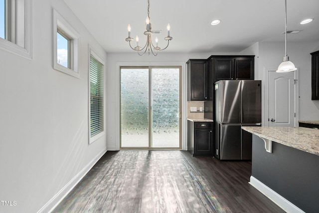 310 Alamosa Pl, Cary, NC 27519 - kitchen featuring freestanding refrigerator, a chandelier, plenty of natural light, dark wood finished floors, and recessed lighting
