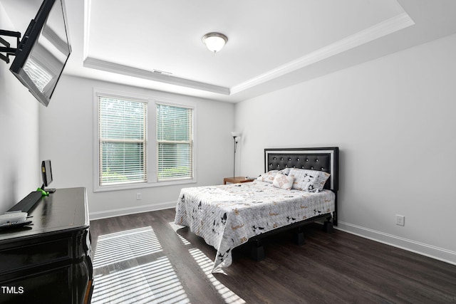 310 Alamosa Pl, Cary, NC 27519 - bedroom featuring a raised ceiling, multiple windows, dark wood-style floors, crown molding, and baseboards