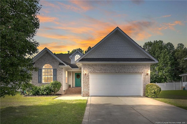 199 Thorncliff Dr, Raeford, NC 28376 - view of front of house with driveway, a garage, and brick siding