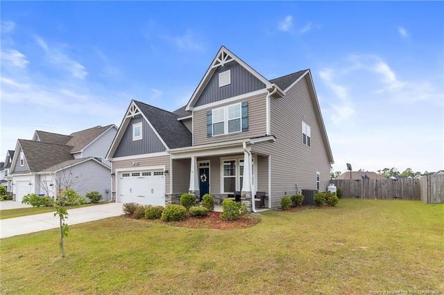 craftsman inspired home featuring covered porch, board and batten siding, concrete driveway, a garage, and central air condition unit