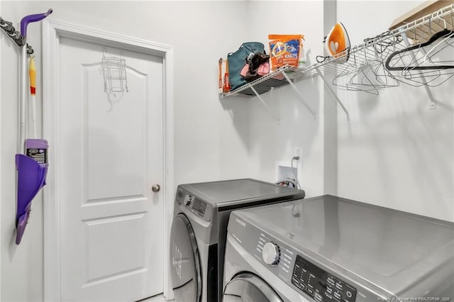 laundry area with independent washer and dryer