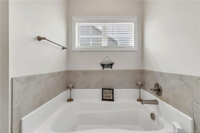 bathroom featuring a garden tub