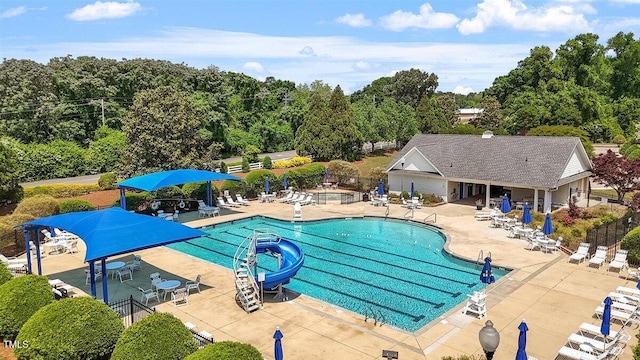 1662 Beechaven Rd, Fuquay Varina, NC 27526 - community pool featuring a water slide and a patio area